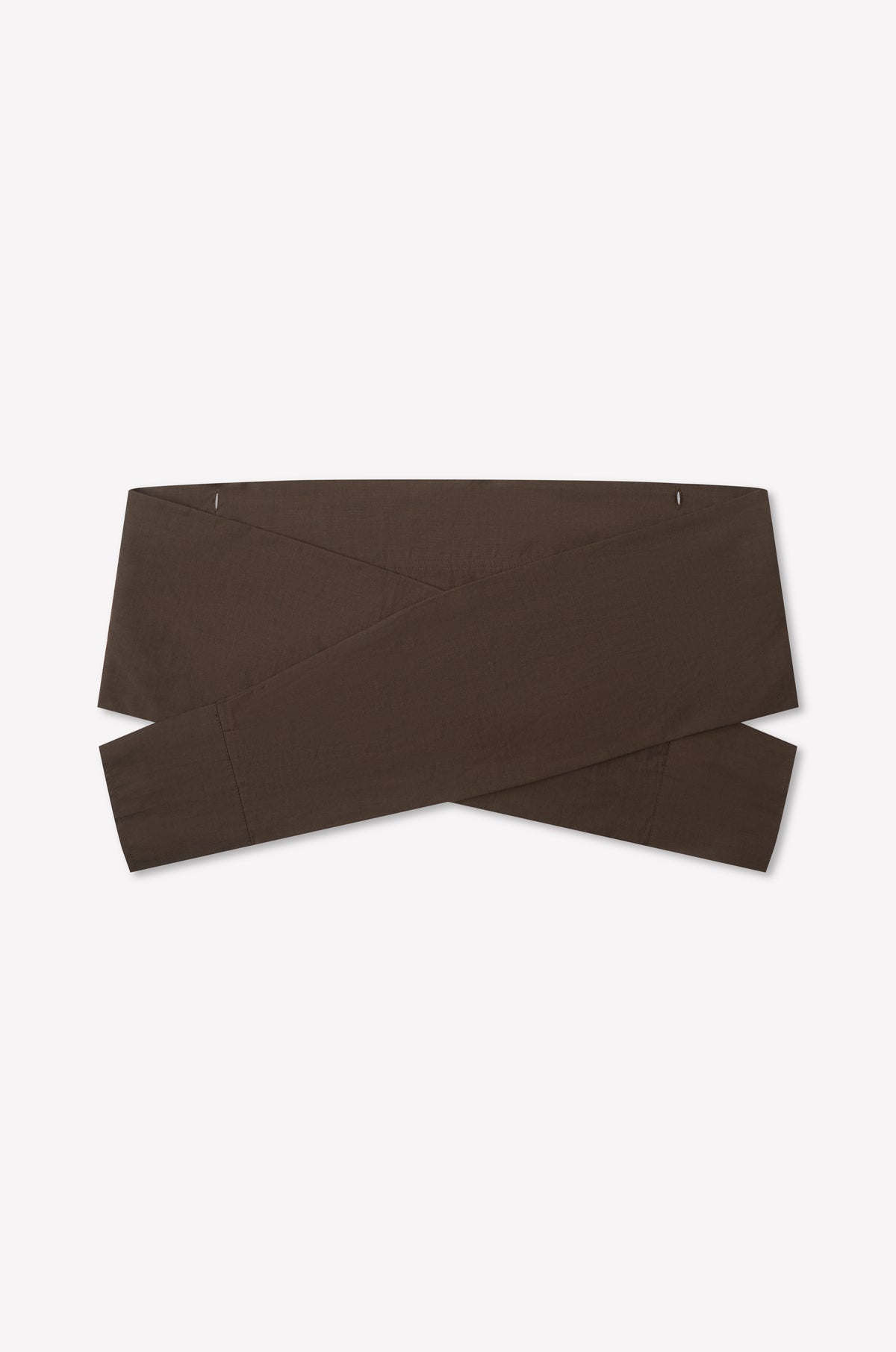 The Shirt Cuff Belt - Toast by Deiji Studios is a wide, dark brown cotton poplin belt with a crisscross design, shown flat on a white background.