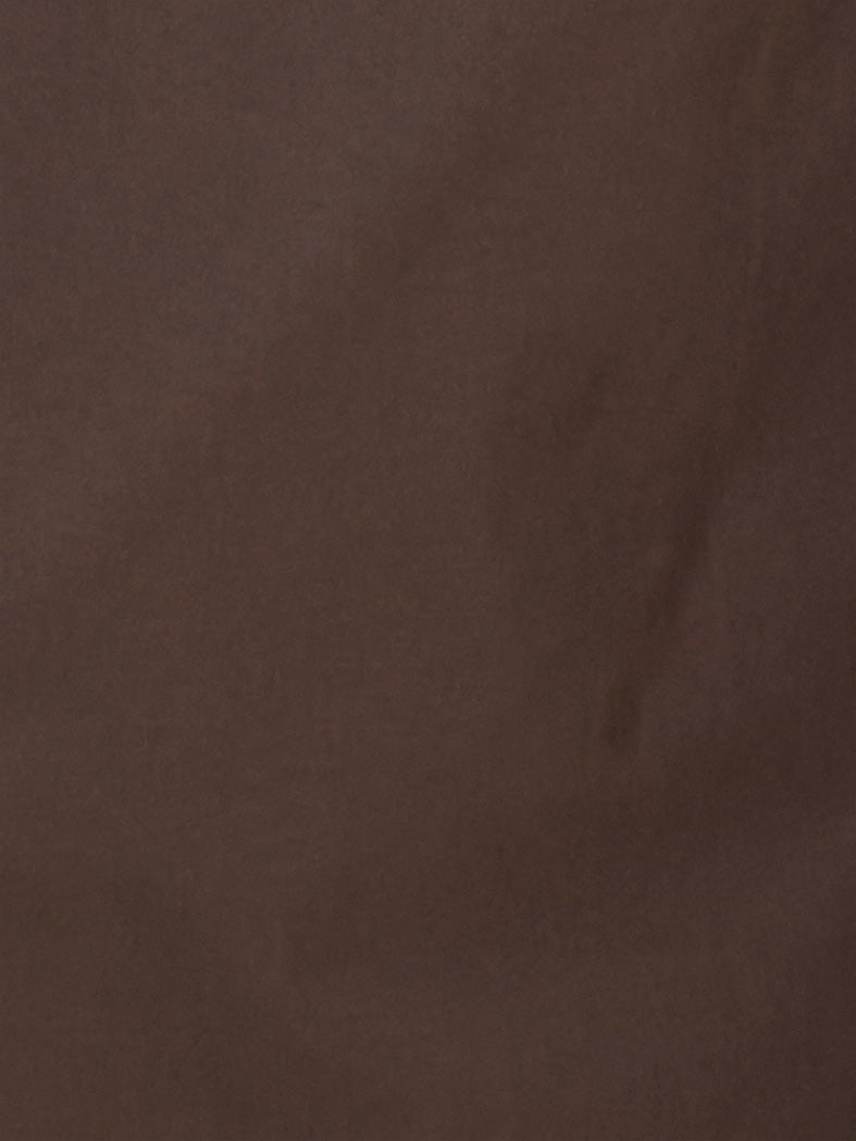 The Tab Pant - Dark Brown features a solid brown textured surface with subtle, uneven shading reminiscent of organic cotton fabric—perfect for creating a stylish wide leg or tab pant look.