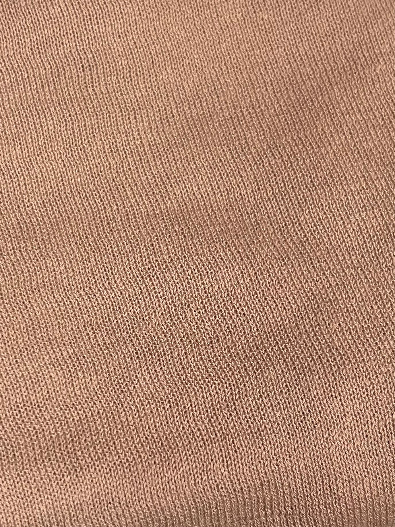 Close-up of the Rolled Knit Top - Light Brown from Deiji Studios, crafted from organic cotton with fine, even stitching and a soft, textured surface—ideal for comfort and style.
