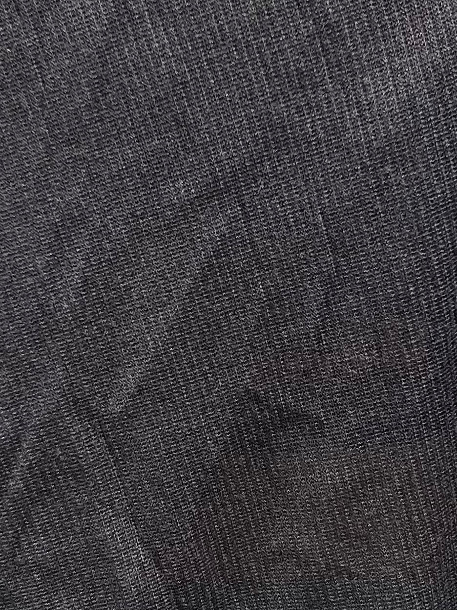 Close-up of the Knit Tank - Steel by Deiji Studios, featuring dark gray textured fabric with sheer fine knit threads, a slight shine, and subtle diagonal creases.