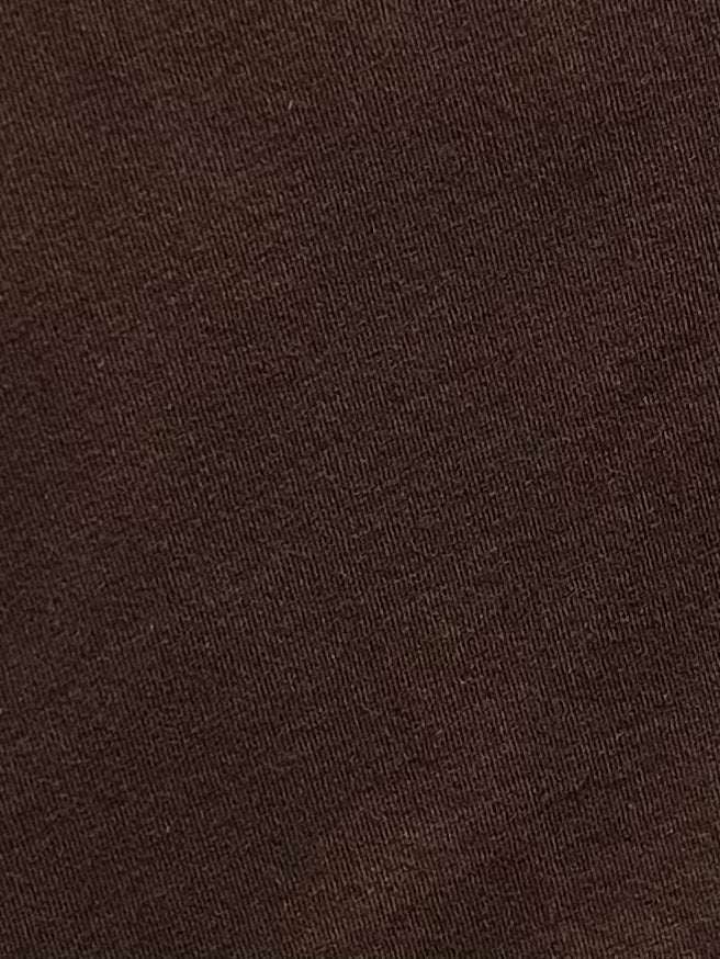 Close-up of the Simple Tee - Caribou, crafted from brown organic cotton with a slightly diagonal weave pattern that highlights its texture and fine threads—a signature detail from Deiji Studios.