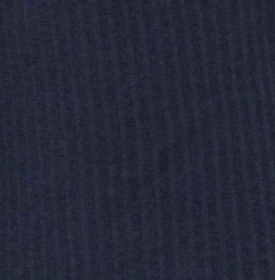 Close-up of the Polo Knit - Dark Blue, featuring dark navy blue organic cotton corduroy with visible vertical ridges and a soft, textured look.