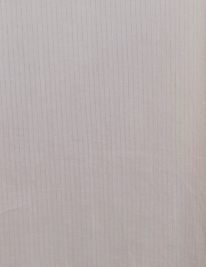 A sheet of light-colored, lined notebook paper with faint grids and subtle texture—reminiscent of the delicate fabric and striped pattern of the Button Frill Mini Dress - Stone Stripe.