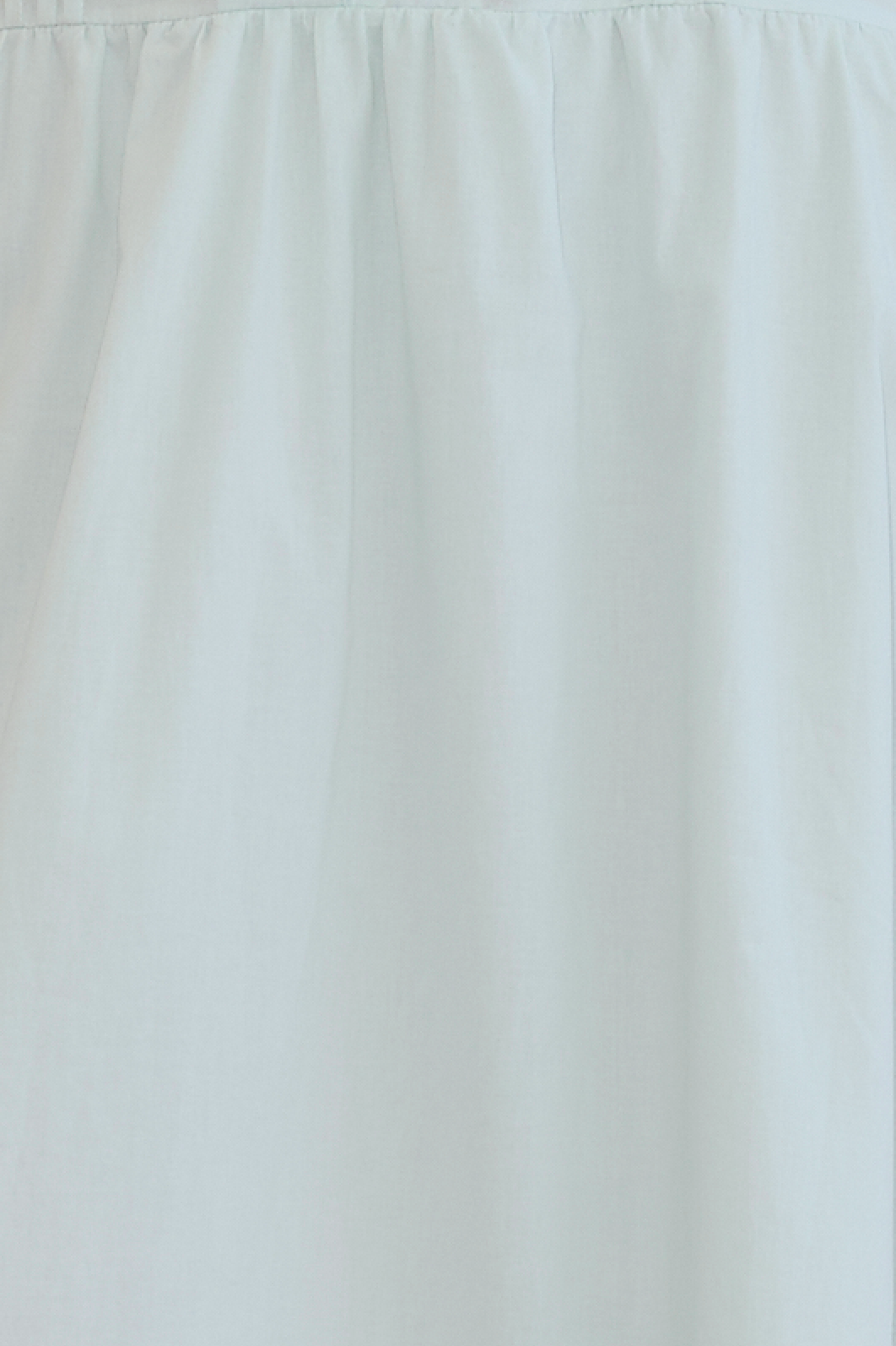 The Pintuck Dress - Mint features light blue fabric with a gathered, ruched top seam for soft folds and subtle texture. This Deiji Studios mid-length dress is lightweight with a smooth, matte finish for effortless style.