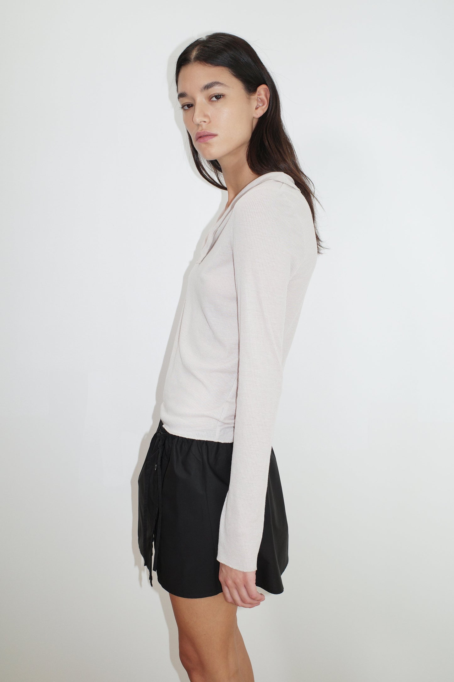 female model wears the cross collar top by Deiji Studios in shell


a sheer fine knit long sleeved top with asymmetric collared neckline, featuring baby locked finishes and a relaxed fit


made from a responsible blend of 85% Recycled Polyester and 15% Viscose

paired with a black cotton skirt