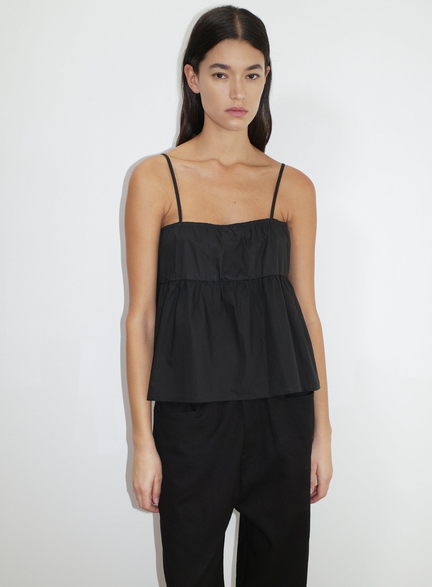 the double tie top by Deiji Studios in black


reversible relaxed top featuring flattering curved neckline and two tie detail at front, drawcord casing feature and fine straps.


made from 100% organic cotton poplin

paired with a black cotton trouser