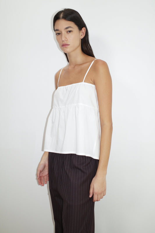 female model wears the double tie top by Deiji Studios in white


reversible relaxed top featuring flattering curved neckline and two tie detail at front, drawcord casing feature and fine straps.


made from 100% organic cotton poplin

paired with a pinstripe licorice wool pant