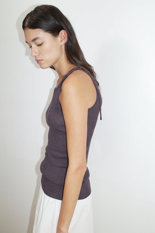 female model wears the one tie top by Deiji Studios in eggplant


a minimalist, fully fashioned tank-style knit top featuring asymmetrical tie strap design made with a lightweight ribbed texture


made from 90% eco-viscose and 10% linen

paired with a white cotton skirt