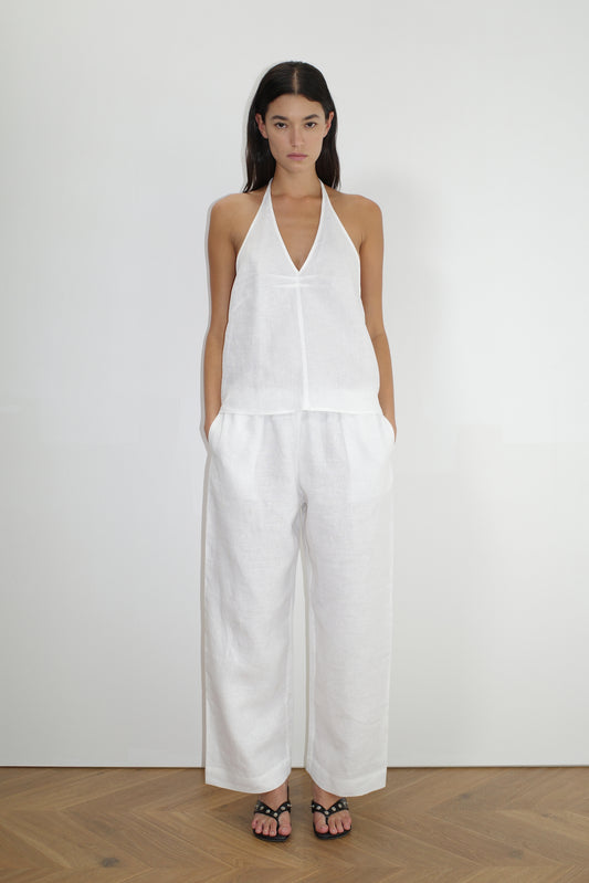 female model wears the linen ease trouser by Deiji Studios in white


the ankle length pant features a soft minimal elastic waist with side seam pockets in a straight leg


can be worn at home, in bed, or out

made from 100% GOTS certified organic, OEKO-TEX 100 certified and EU certified stone washed french linen

paired with a white linen halter top