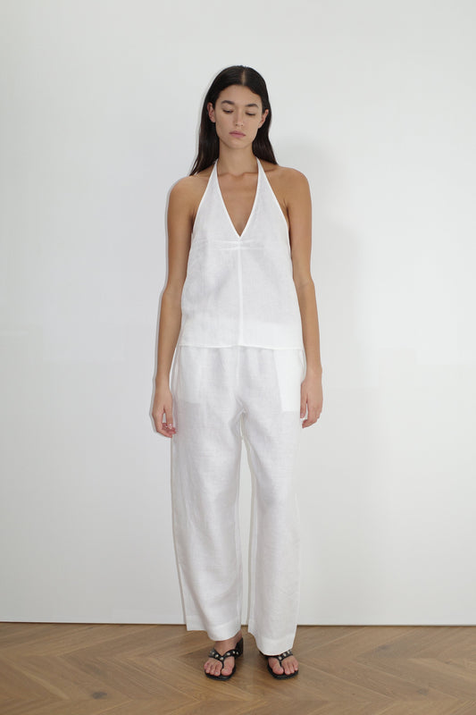 female model wears the linen ease trouser by Deiji Studios in white


the ankle length pant features a soft minimal elastic waist with side seam pockets in a straight leg


can be worn at home, in bed, or out

made from 100% GOTS certified organic, OEKO-TEX 100 certified and EU certified stone washed french linen

paired with a white linen halter top