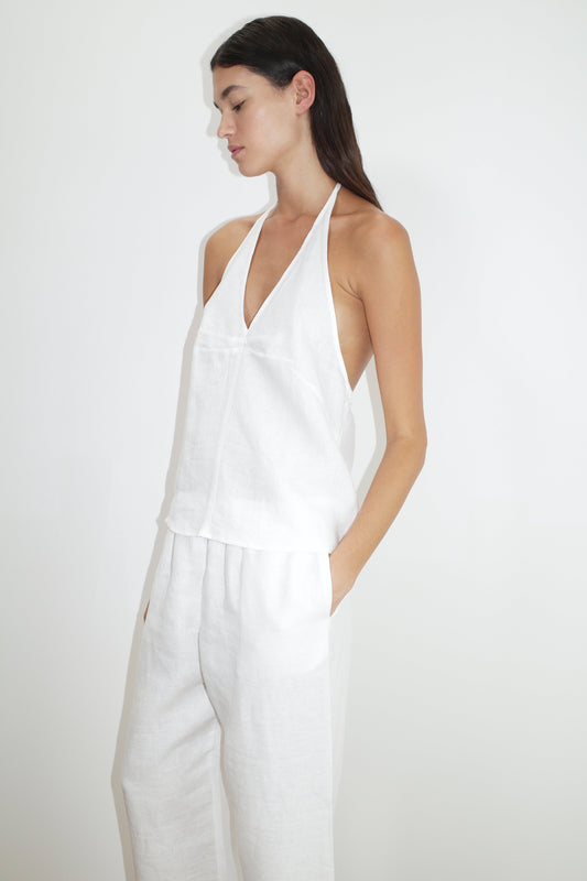female model wears the linen ease trouser by Deiji Studios in white


the ankle length pant features a soft minimal elastic waist with side seam pockets in a straight leg


can be worn at home, in bed, or out

made from 100% GOTS certified organic, OEKO-TEX 100 certified and EU certified stone washed french linen

paired with a white linen halter top
