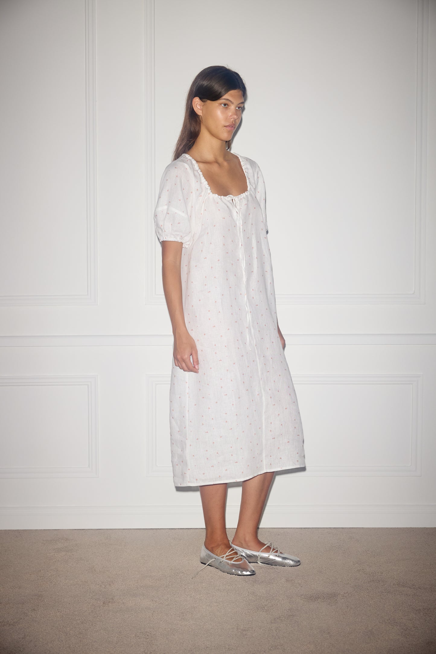 Female model wearing Curved Seam Midi Dress - Corsage Print by Deiji Studios against plain background