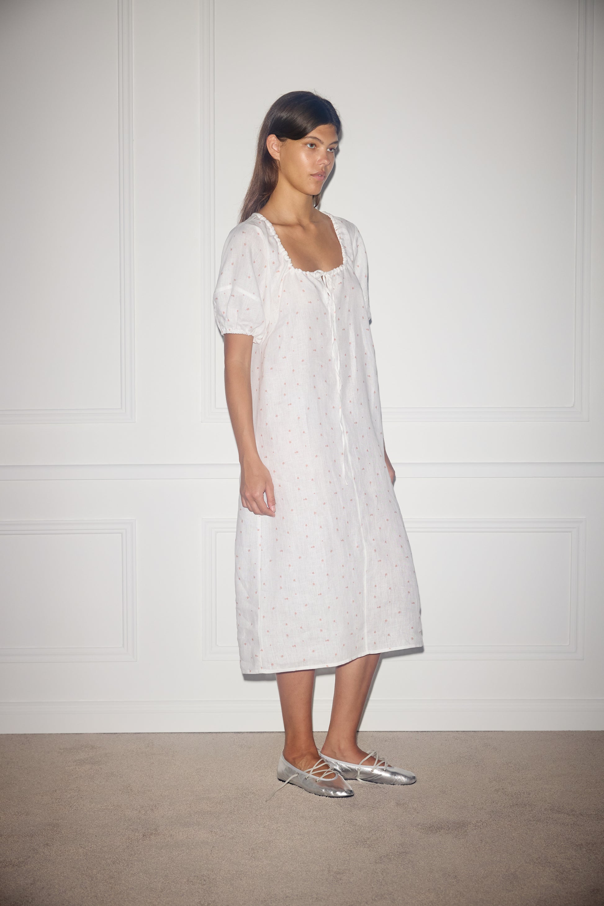Female model wearing Curved Seam Midi Dress - Corsage Print by Deiji Studios against plain background