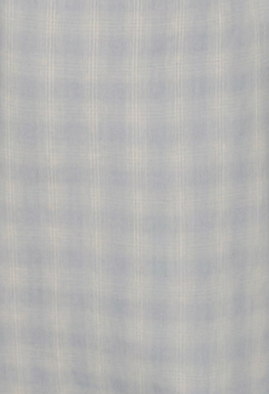 The Side Tie Pant - Blue Check is crafted from a light, soft blue cotton poplin with a subtle plaid pattern and thin white lines, offering a gentle, semi-sheer look perfect for stylish comfort.