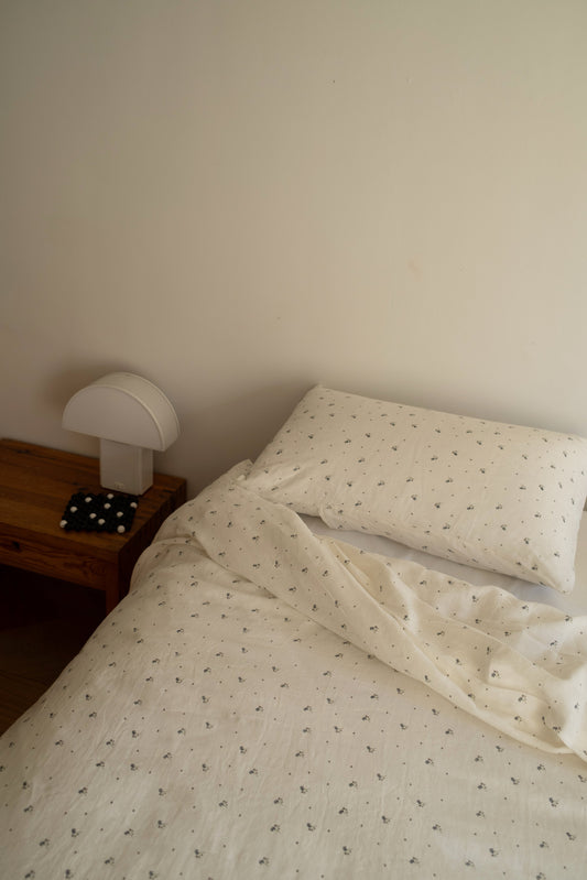 Light room with queen bed and pillows topped with Pillow slip set - Vintage Floral by Deiji Studios