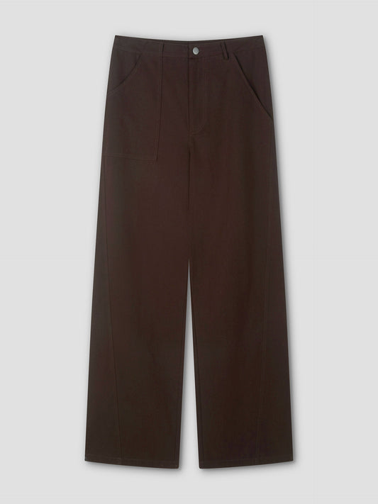 The Pocket Jean - Dark Brown features a wide-leg fit, front pockets, and button closure, shown against a light gray background.
