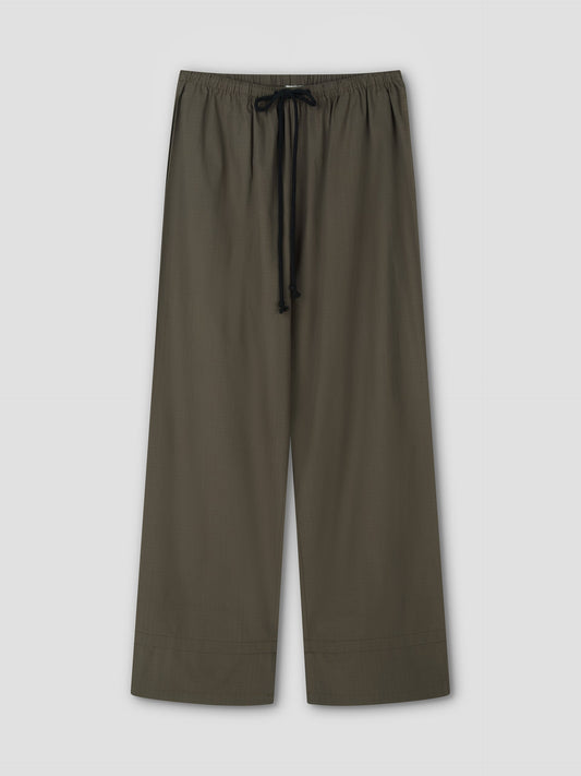 Loose-fitting Layered Pant - Khaki Check featuring a wide leg, elastic waistband, and black drawstring, displayed flat on a light gray background.