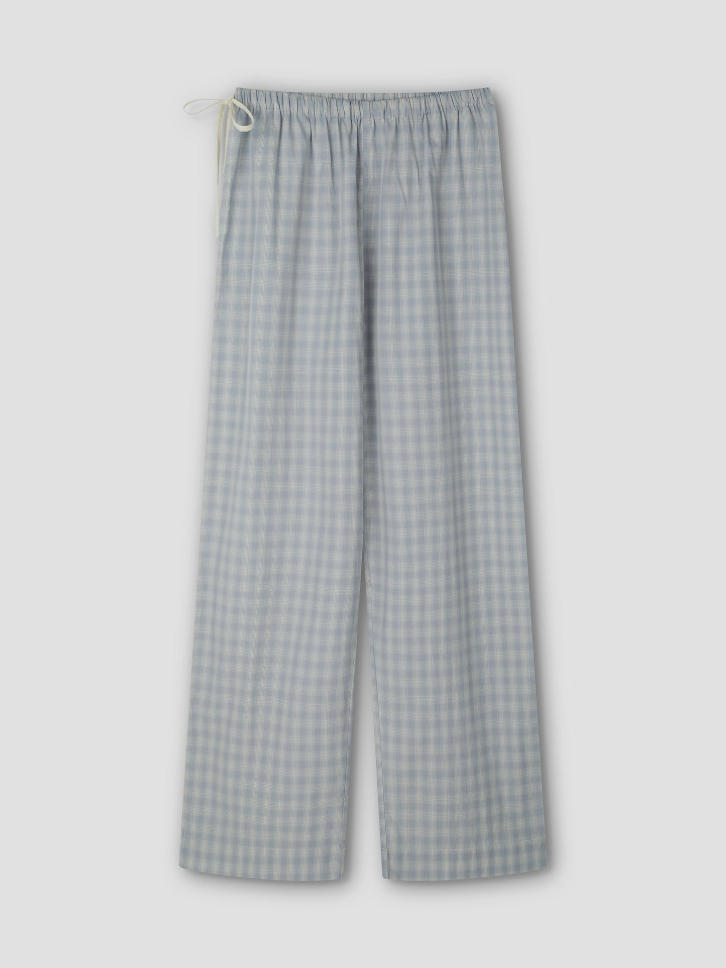 The Side Tie Pant - Blue Check features light blue and white cotton poplin checks, an elastic waistband, and a white drawstring, shown flat on a light grey background.