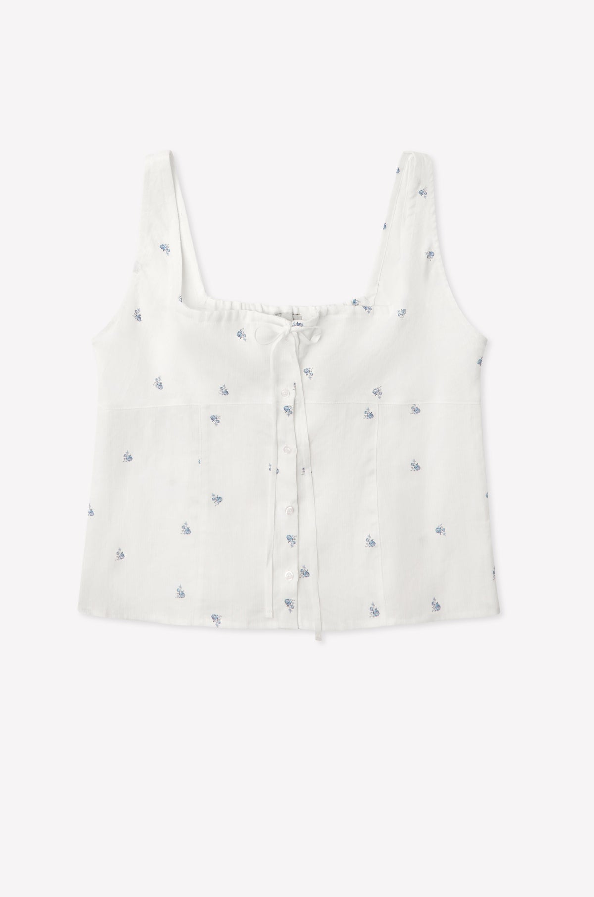 The Relax Short Set - Floral Blue features a white sleeveless crop top with a square neckline, blue floral prints, front buttons, and a drawstring chest detail—shown laid flat on a plain white background.