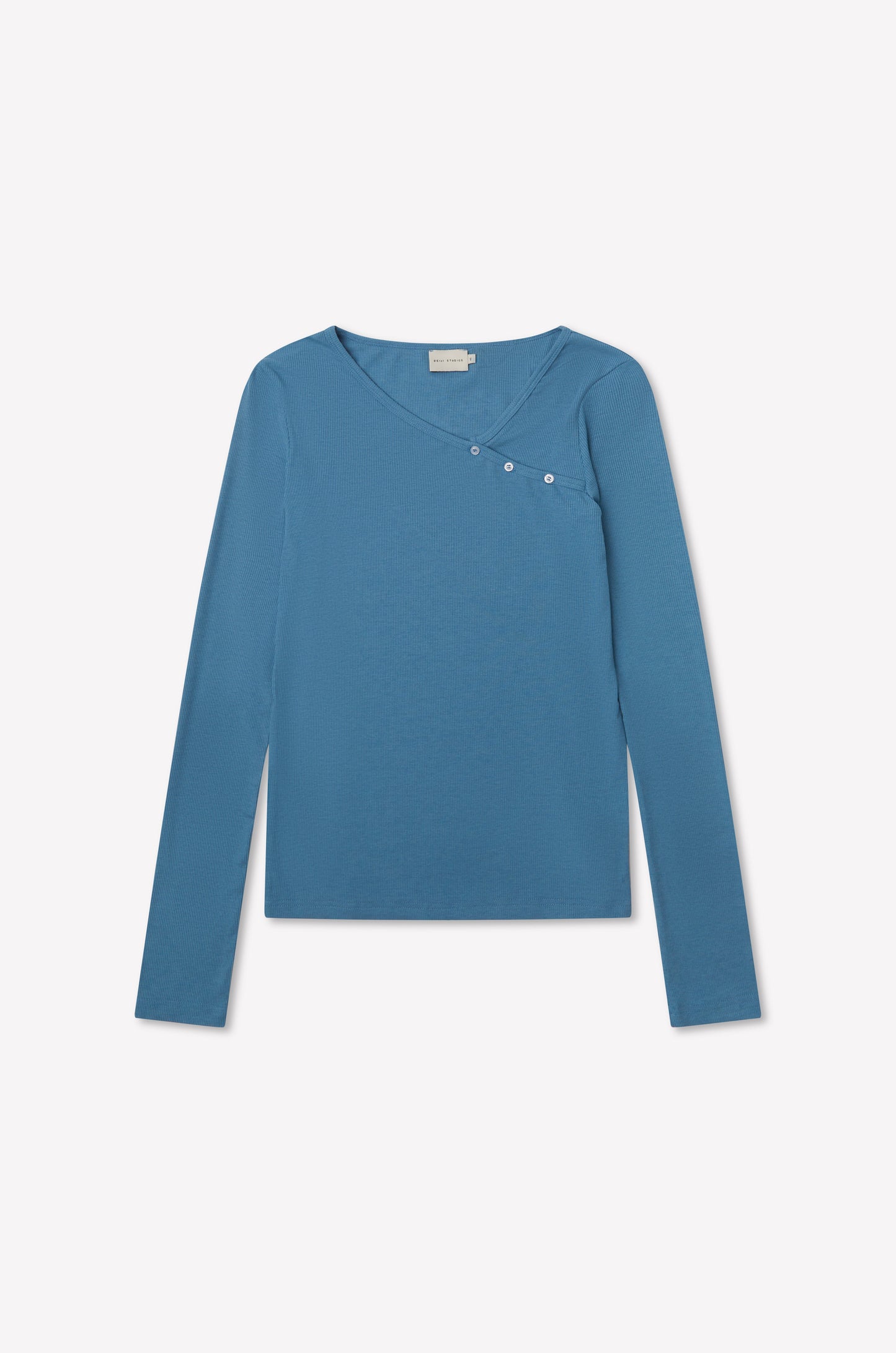 The Multi Button Top - Aqua by deiji studios is a fitted long sleeve jersey in blue with an asymmetrical neckline and three small buttons on the upper right, shown on a plain white background.