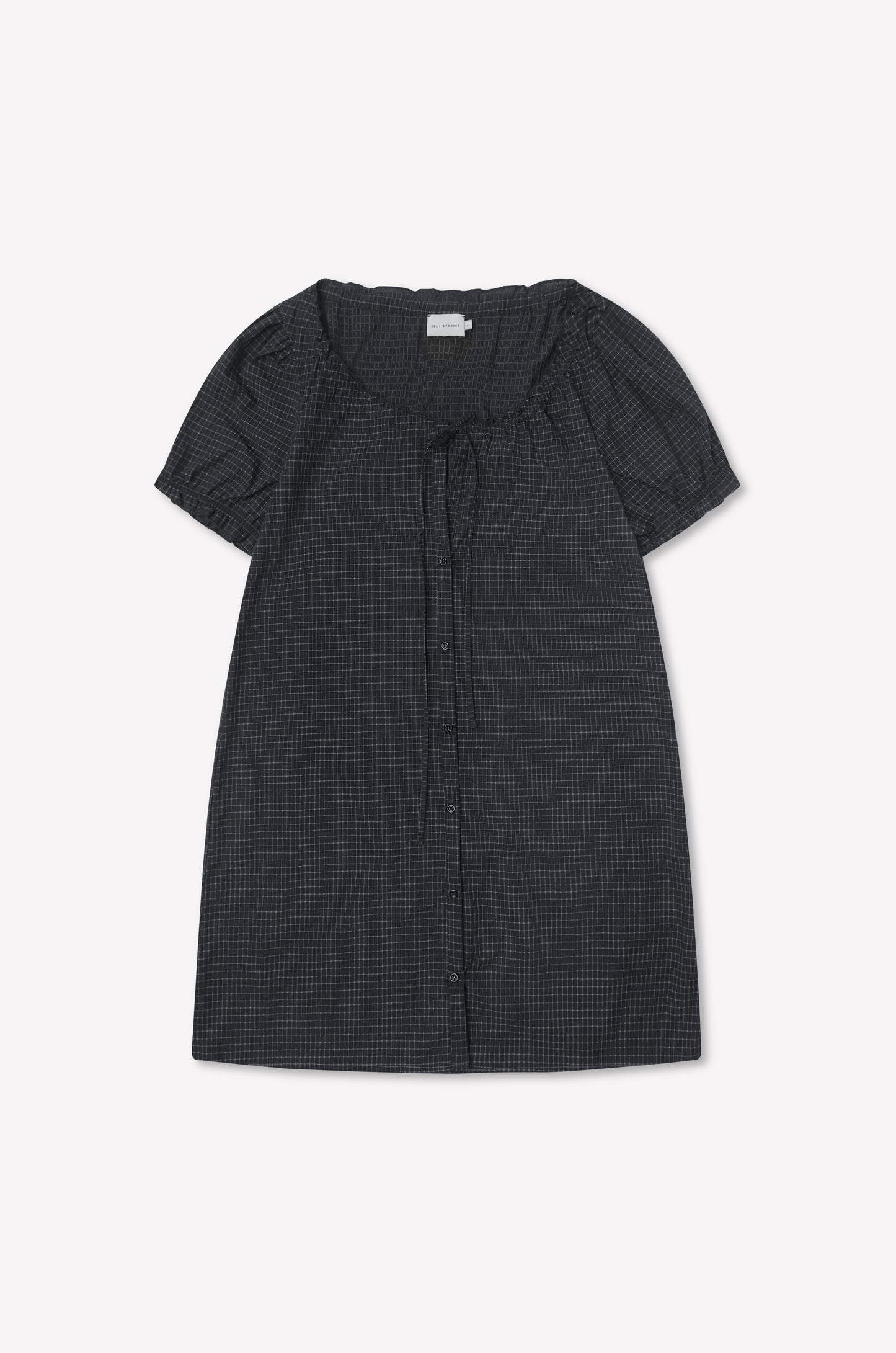 Buttoned Mini Dress - Mono Grid: short-sleeved, dark checkered dress with flounced sleeves, round neckline, front buttons, and neck tie detail, displayed flat on a white background.