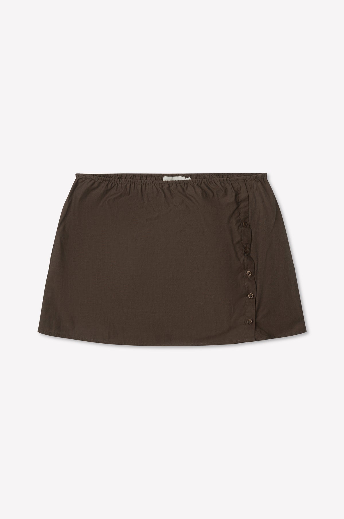 The Pleat Split Skirt - Toast is a brown cotton poplin mini skirt with an elastic waistband and side button detailing, shown laid flat on a white background.