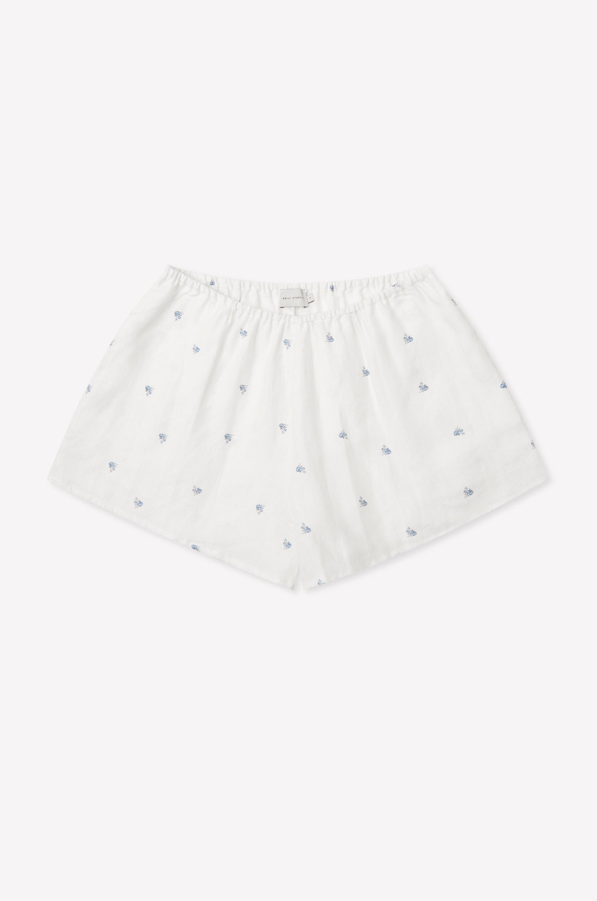 The Relax Short Set - Floral Blue features white cotton boxer shorts with a loose fit, elastic waistband, and delicate blue floral patterns, reminiscent of Deiji Studios' signature comfort, shown against a plain white background.