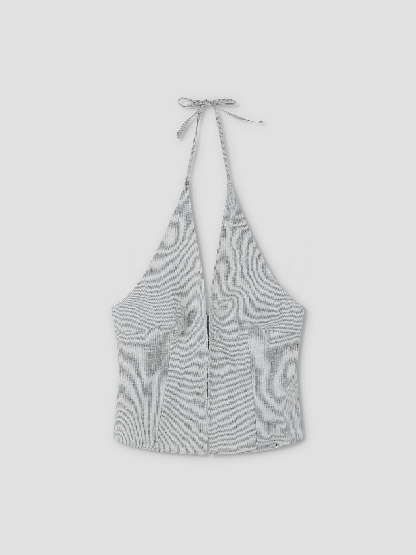 The Close Halter Top - Fine Stripe by Deiji Studios features a light gray hue, deep V neckline, fine stripe pattern, fitted silhouette, and neck tie closure, shown against a plain light background.