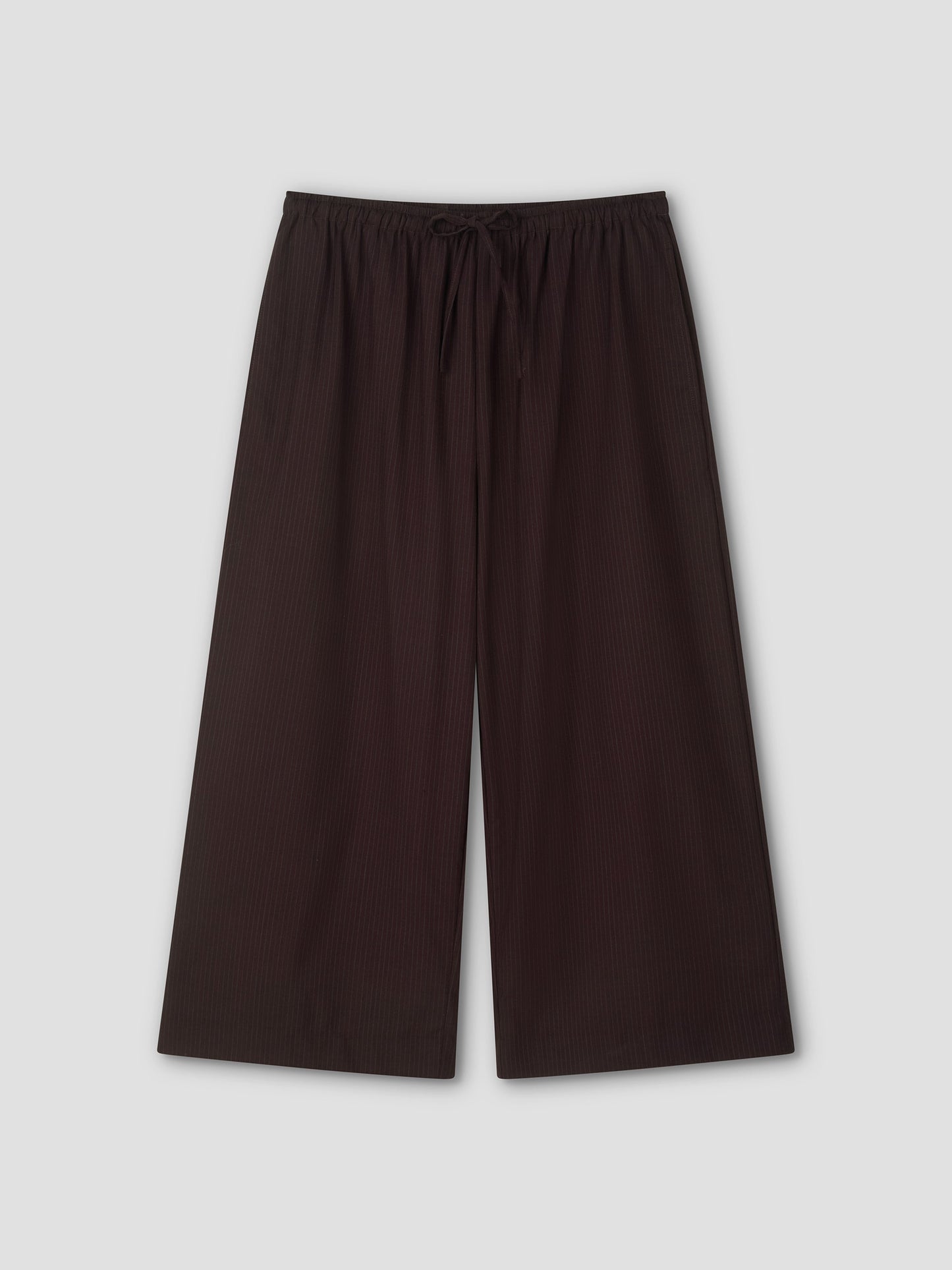 Wide-leg, ankle-length Drawcord Culotte in Burgundy Brown Stripe with subtle vertical pinstripes and elasticated waistband, laid flat on a light gray background. Inspired by the relaxed yet refined style of Deiji Studios.