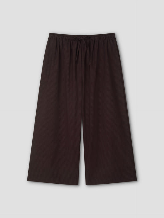 Wide-leg, ankle-length Drawcord Culotte in Burgundy Brown Stripe with subtle vertical pinstripes and elasticated waistband, laid flat on a light gray background. Inspired by the relaxed yet refined style of Deiji Studios.