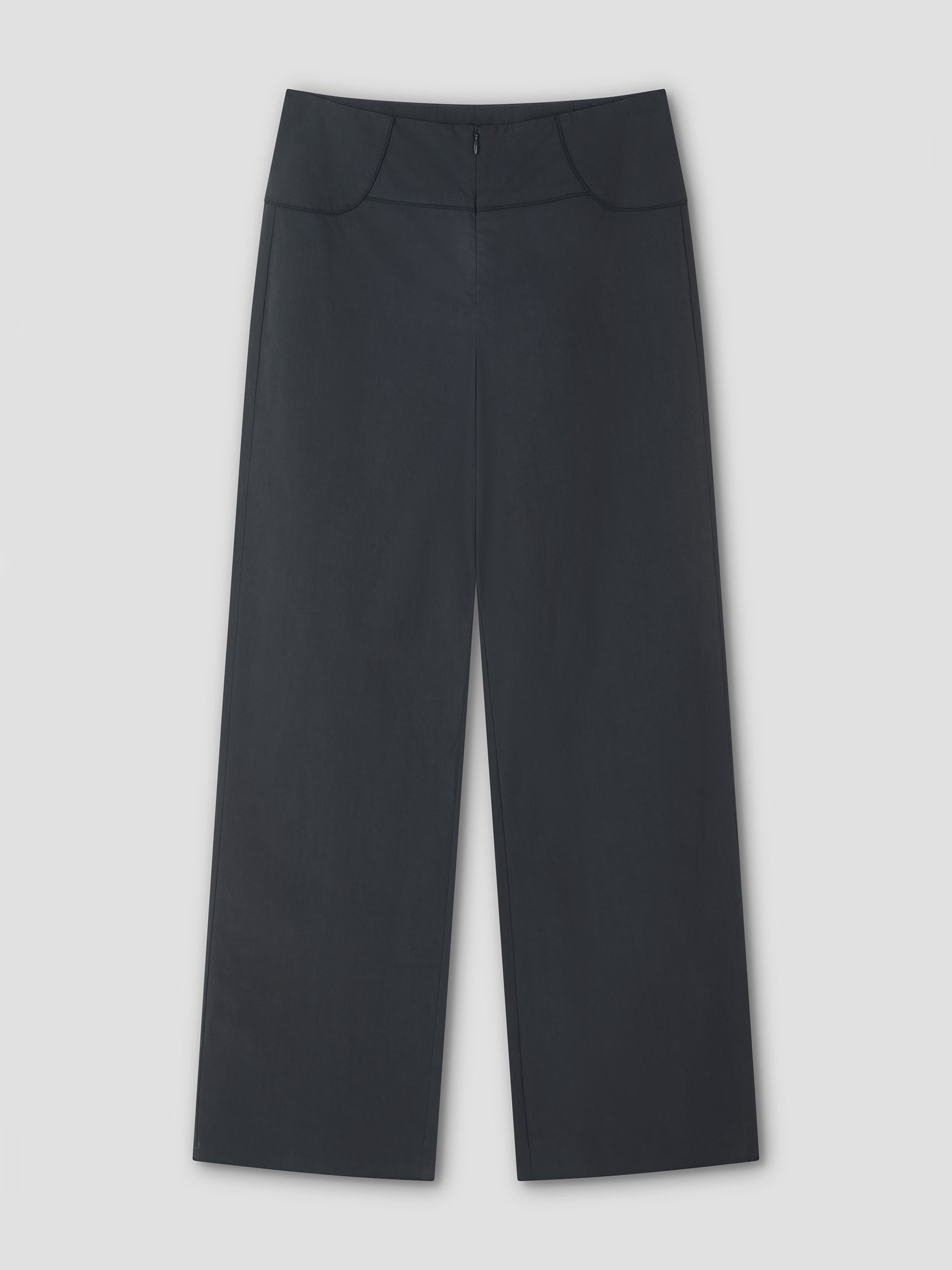 The Panelled Pant - Charcoal features a wide-leg, high-waisted design with front seams and a slight flare, straight-leg silhouette, shown flat on a light gray background.