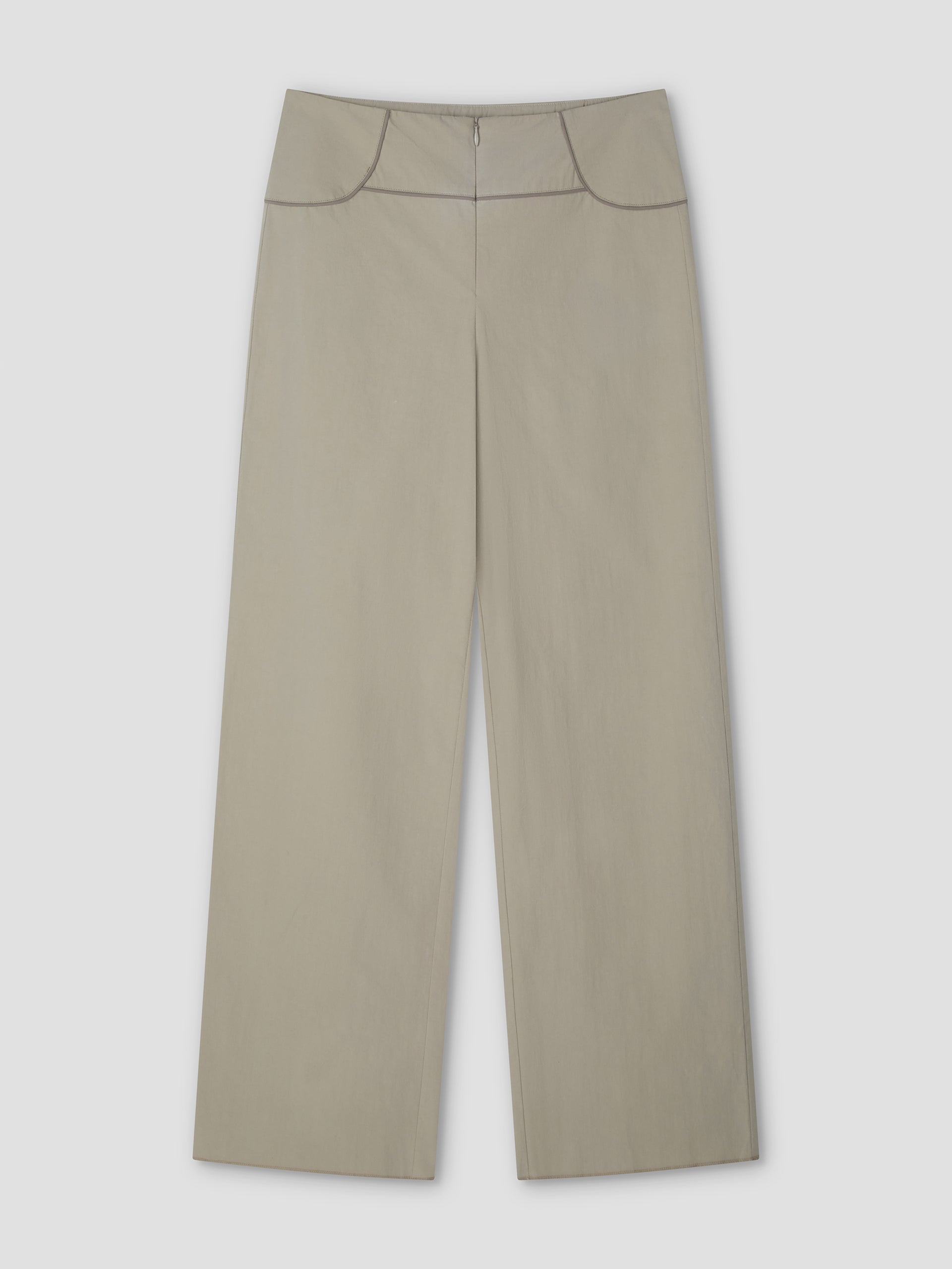 Panelled Pant - Stone: wide-leg beige high-waist pant with front zipper and subtle seam details at waistband and hips. Features a relaxed straight-leg silhouette, shown laid flat on a light gray background. From Deiji Studios.