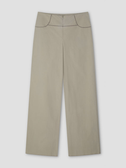 Panelled Pant - Stone: wide-leg beige high-waist pant with front zipper and subtle seam details at waistband and hips. Features a relaxed straight-leg silhouette, shown laid flat on a light gray background. From Deiji Studios.