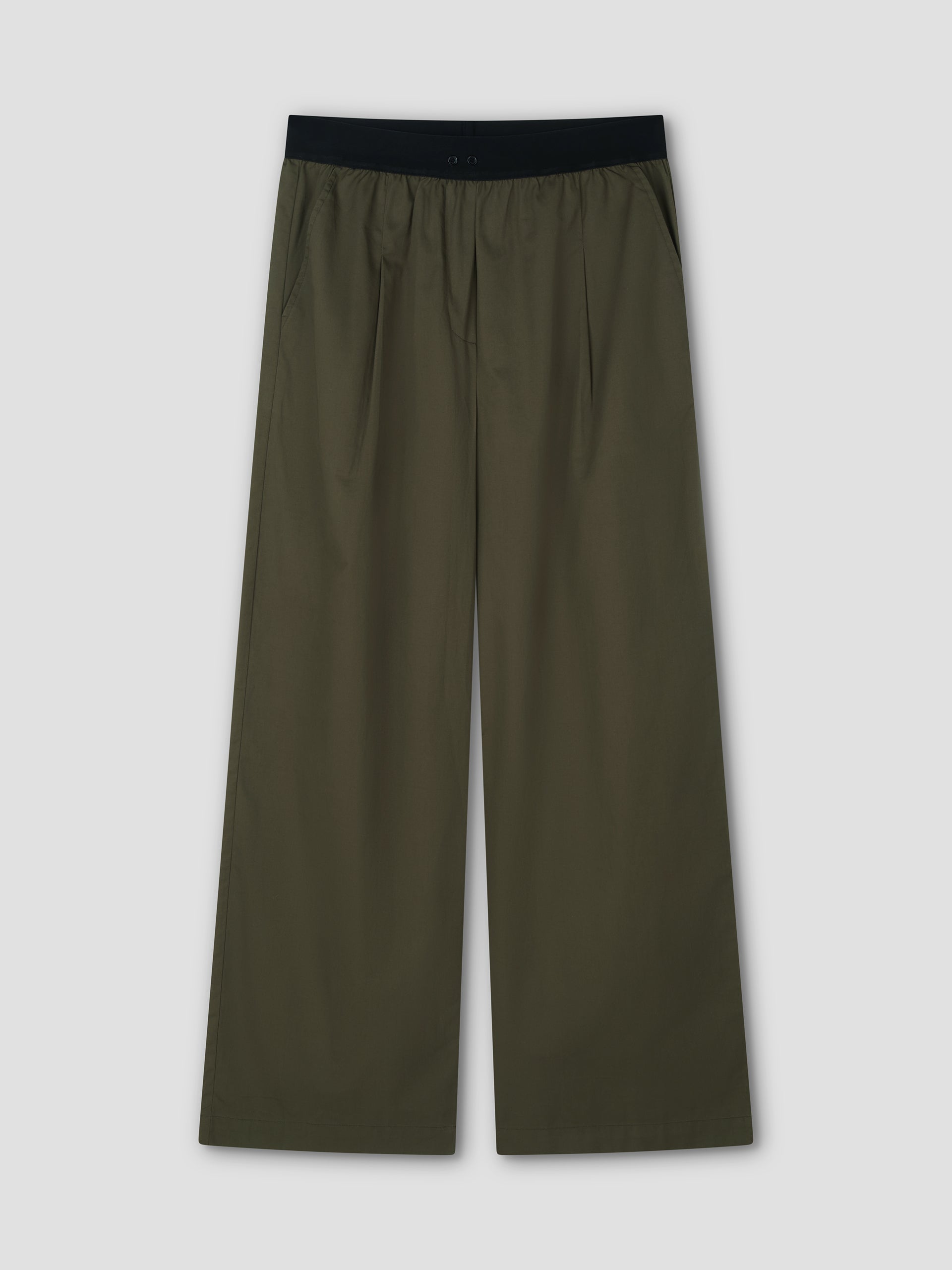 The Contrast Waist Pant - Olive by Deiji Studios features a black elastic waistband, relaxed wide-leg fit, side pockets, and front pleats, shown flat on a light gray background.