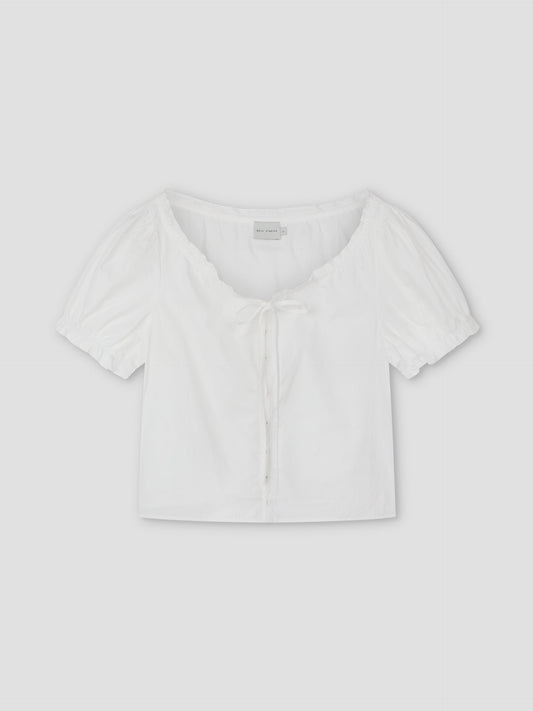 The Close Shirt - White is a cropped, short-sleeve blouse with a relaxed fit, scoop neckline, front buttons, and chest tie detail, shown flat on a light background.