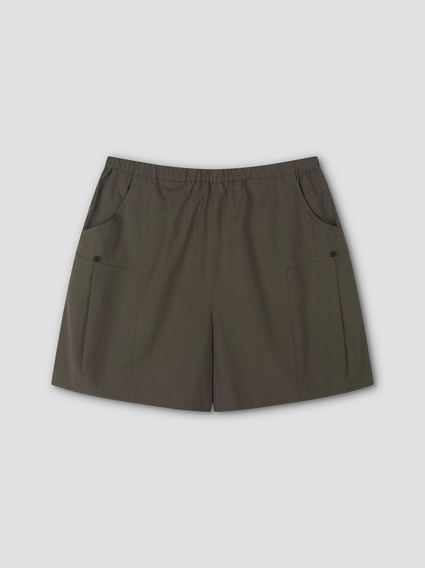 A pair of Deiji Studios Pleat Short - Khaki Check with an elastic waistband and two front pockets, laid flat on a light gray background.