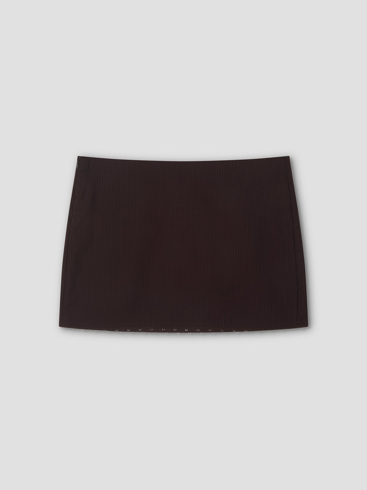 A mini-length Eye Skirt in burgundy brown stripes with a straight cut, displayed against a light gray background.