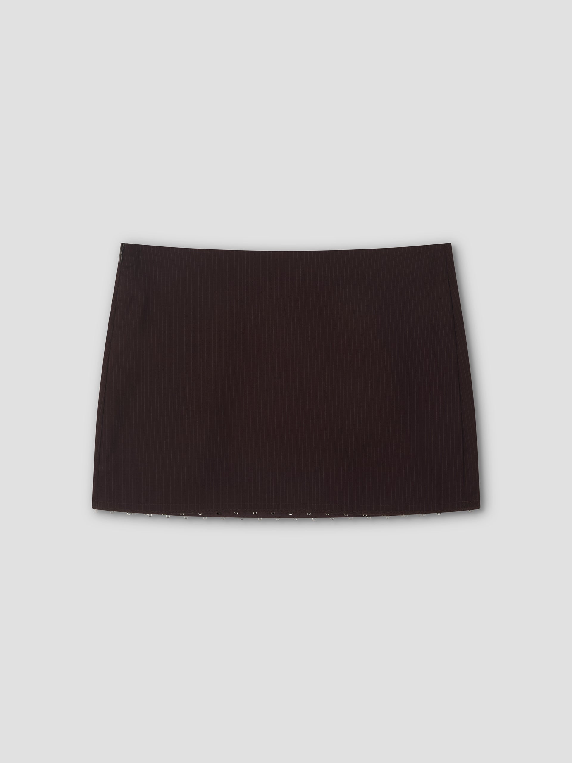 A mini-length Eye Skirt in burgundy brown stripes with a straight cut, displayed against a light gray background.