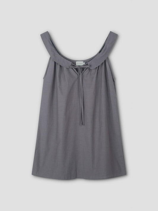 Sleeveless, loose-fitting Rounded Neck Dress in Currant by Deiji Studios features a wide neckline and small front tie. Crafted from lightweight fabric that drapes softly, shown against a plain light background.