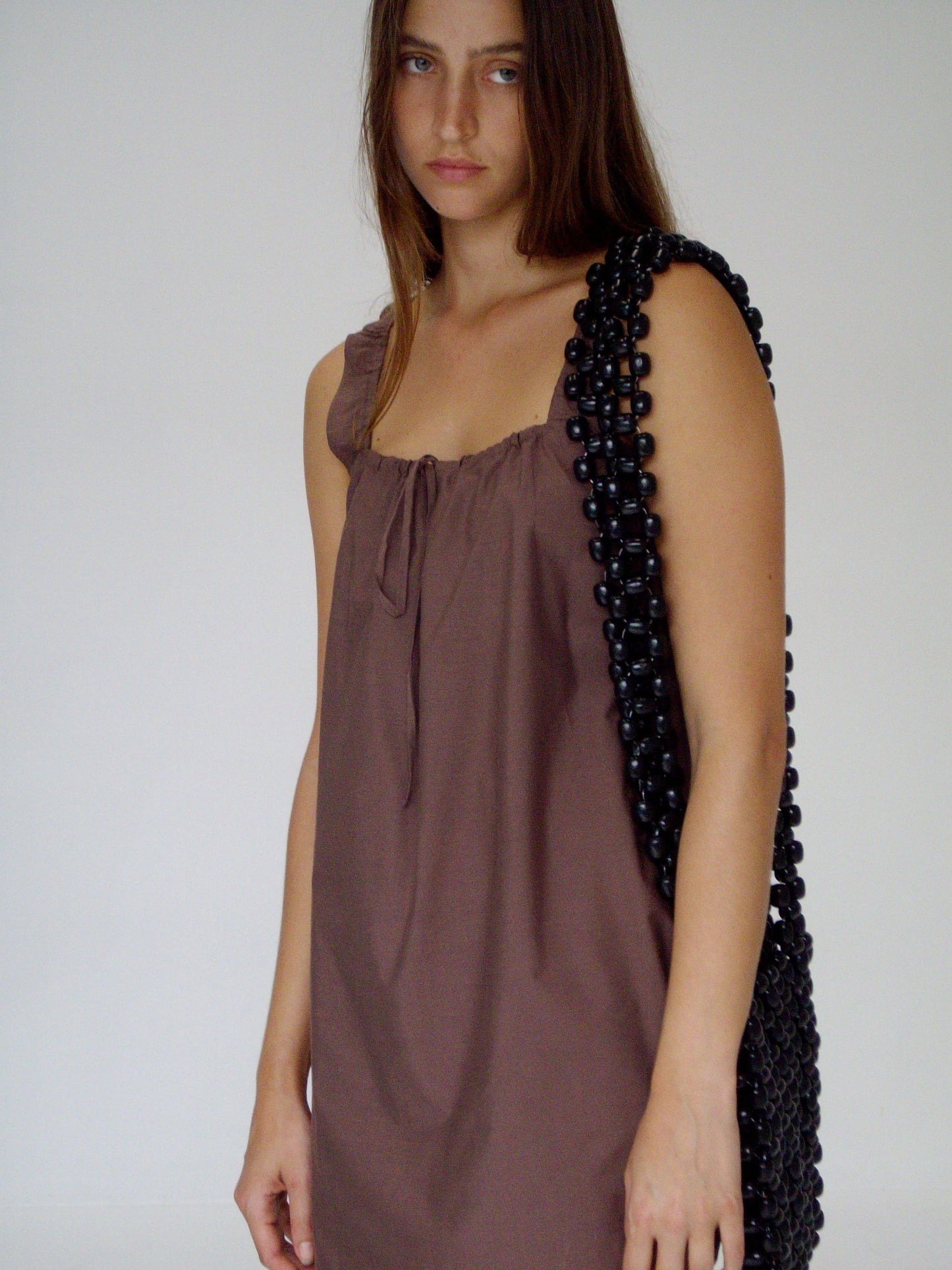 female model wears the bow dress in cedar exclusive to Deiji Studios

a crisp and lightweight mini-length dress features a flattering gathered square neckline with keyhole and tie front feature and side seam pockets


made from 100% GOTS certified organic cotton poplin