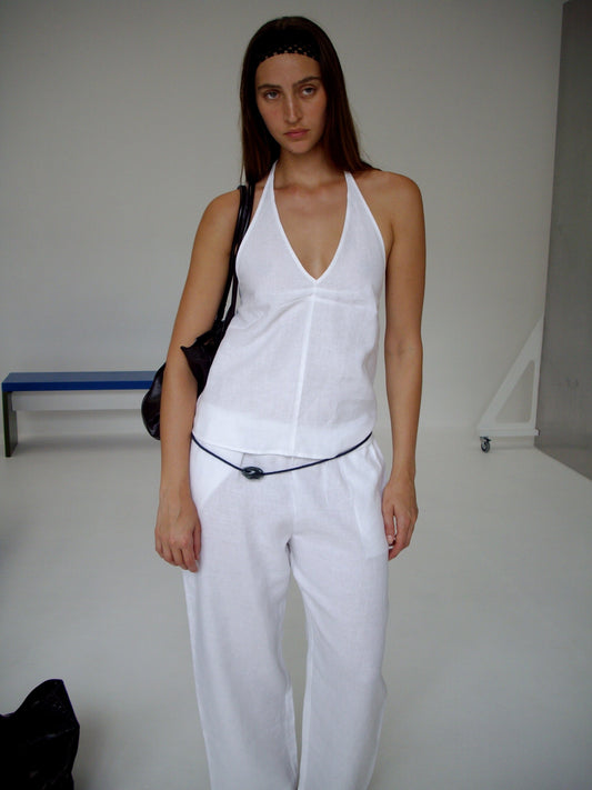 female model wears the linen ease trouser by Deiji Studios in white


the ankle length pant features a soft minimal elastic waist with side seam pockets in a straight leg


can be worn at home, in bed, or out

made from 100% GOTS certified organic, OEKO-TEX 100 certified and EU certified stone washed french linen

paired with a white linen halter top