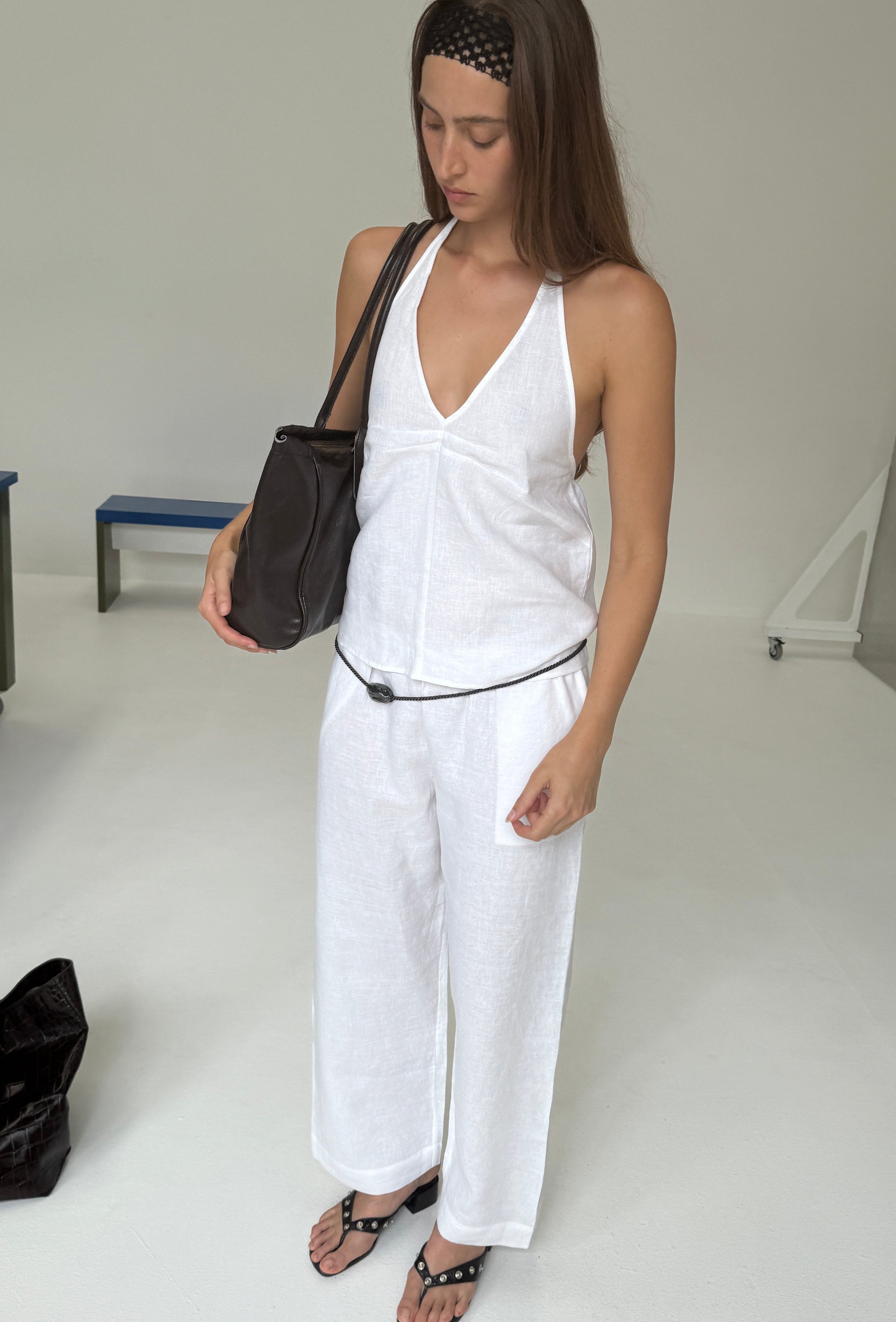 female model wears the linen ease trouser by Deiji Studios in white


the ankle length pant features a soft minimal elastic waist with side seam pockets in a straight leg


can be worn at home, in bed, or out

made from 100% GOTS certified organic, OEKO-TEX 100 certified and EU certified stone washed french linen

paired with a white linen halter top