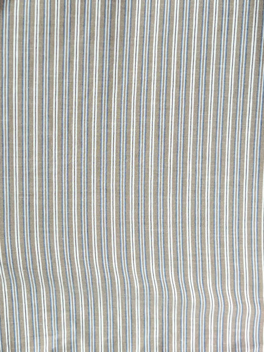 The Ruffle Mini Skirt - Seas Stripe features vertical stripes in beige, white, and light blue on organic cotton with a slight texture, creating a soft, airy look ideal for this Deiji Studios design.