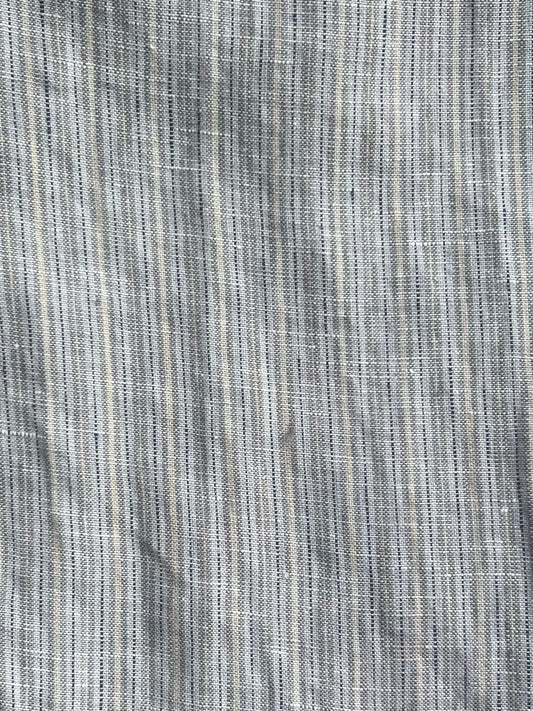 Close-up of Deiji Studios' Double Waist Linen Pant - Haze Blue, showing woven fabric with a fine striped texture in muted gray and haze blue tones, subtle vertical lines, and slight creases.