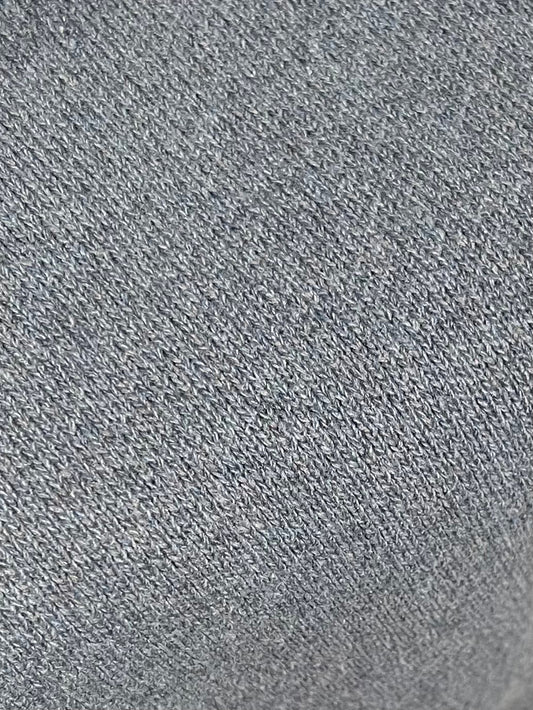 Close-up of the Glacier Blue Pullover, highlighting its textured knit pattern with small, evenly spaced stitches.