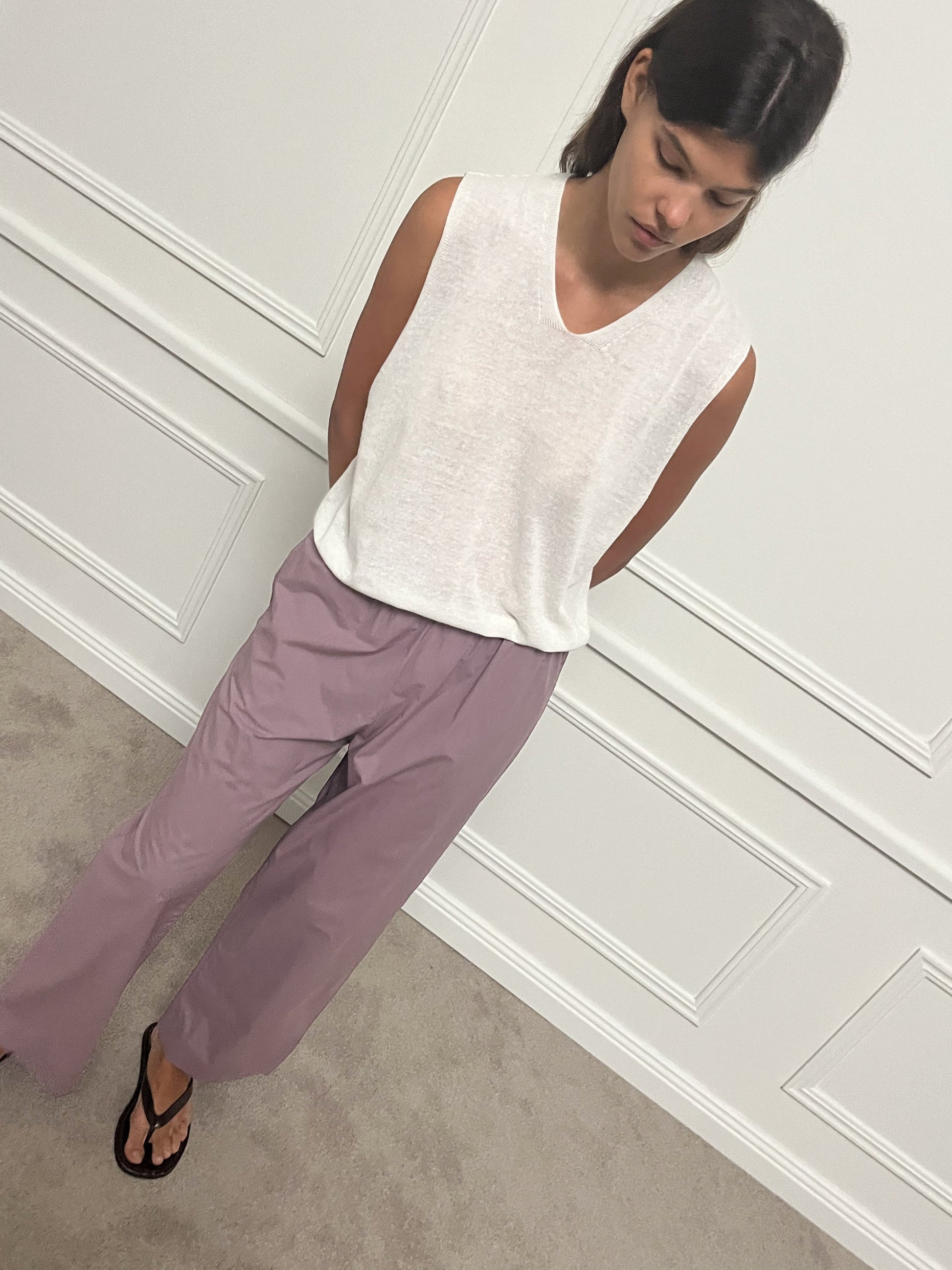 Female model wearing Ease Trouser - Mauve by Deiji Studios against plain background