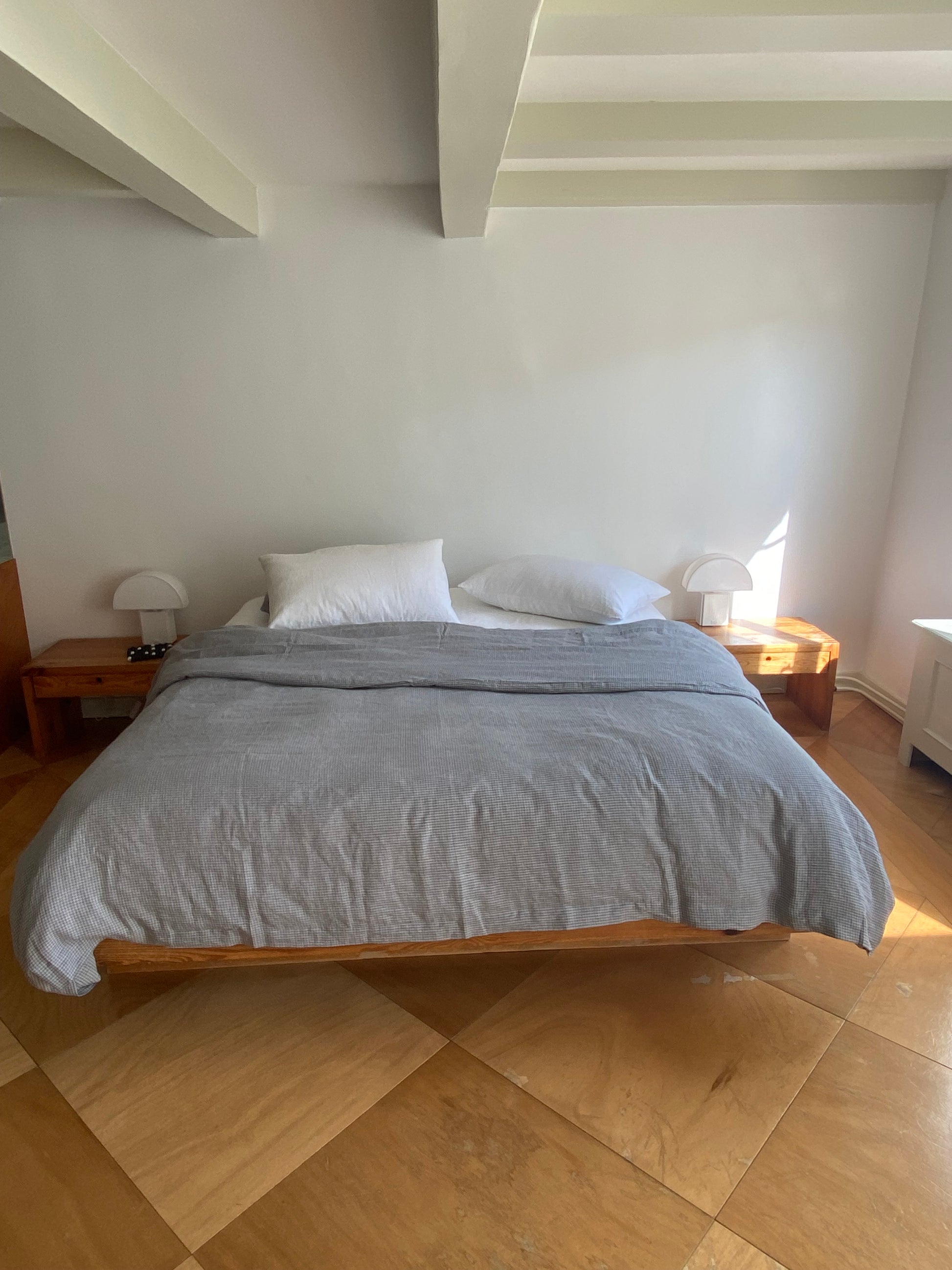 Light room with queen bed topped with Duvet cover - field check by Deiji Studios