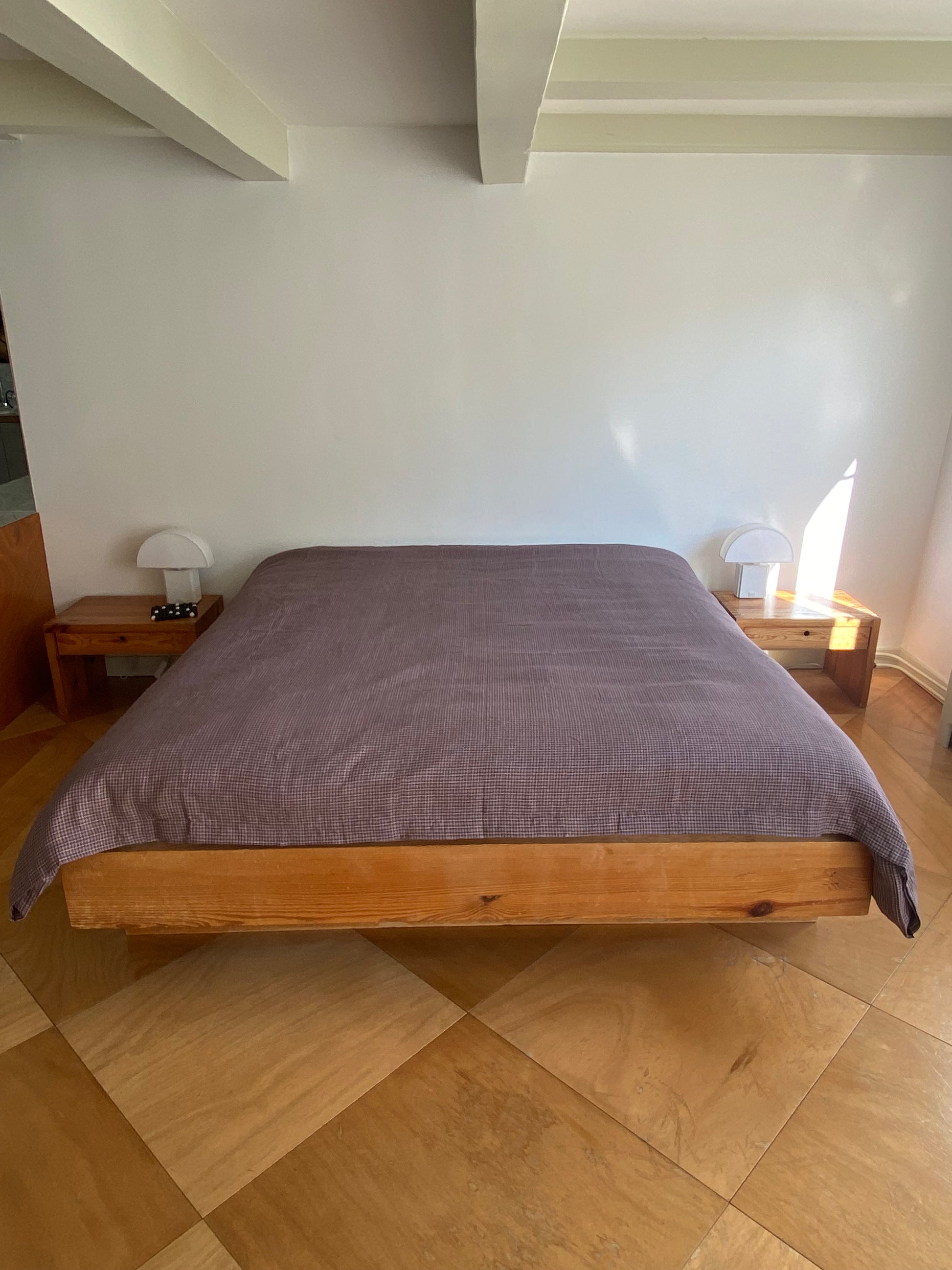 Light room with queen bed topped with Duvet cover - russet check by Deiji Studios