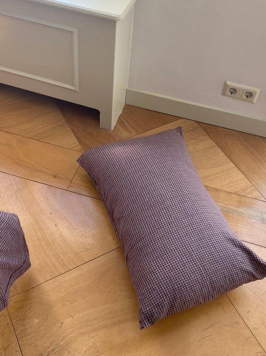 Light room with queen bed and pillows topped with Pillow slip set - Russet Check by Deiji Studios