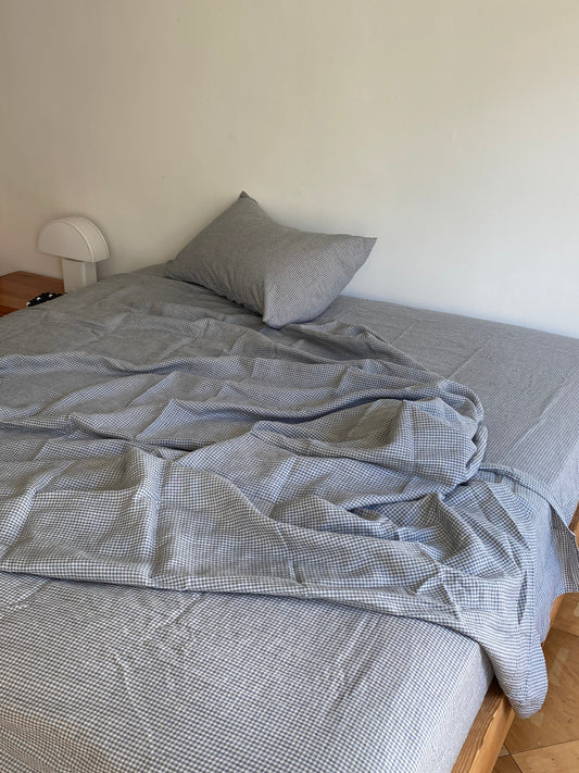 Light room with queen bed topped with Sheets - field check by Deiji Studios